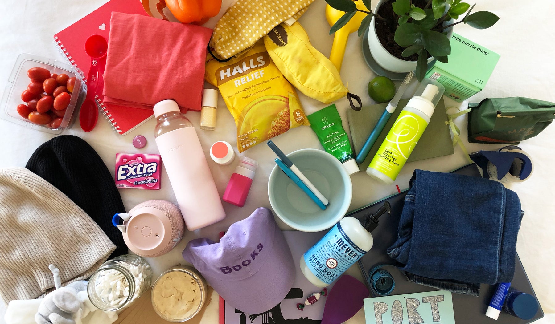 assortment of household items arranged in a rainbow