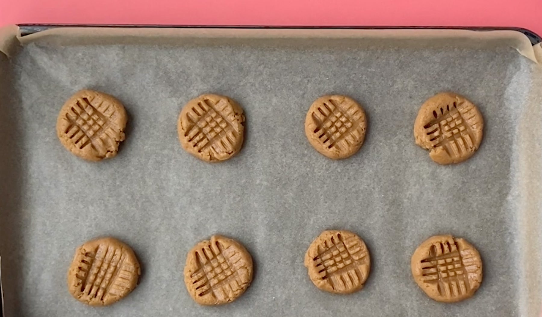 peanut butter cookie dough on a baking sheet